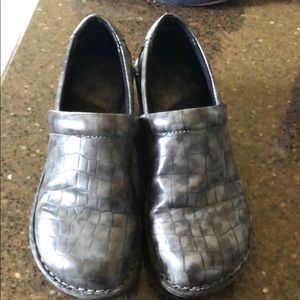 Woman’s gray clog shoes